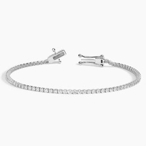 açık kilit yapısı görülen beyaz altın yuvarlak kesim pırlanta suyolu bileklik